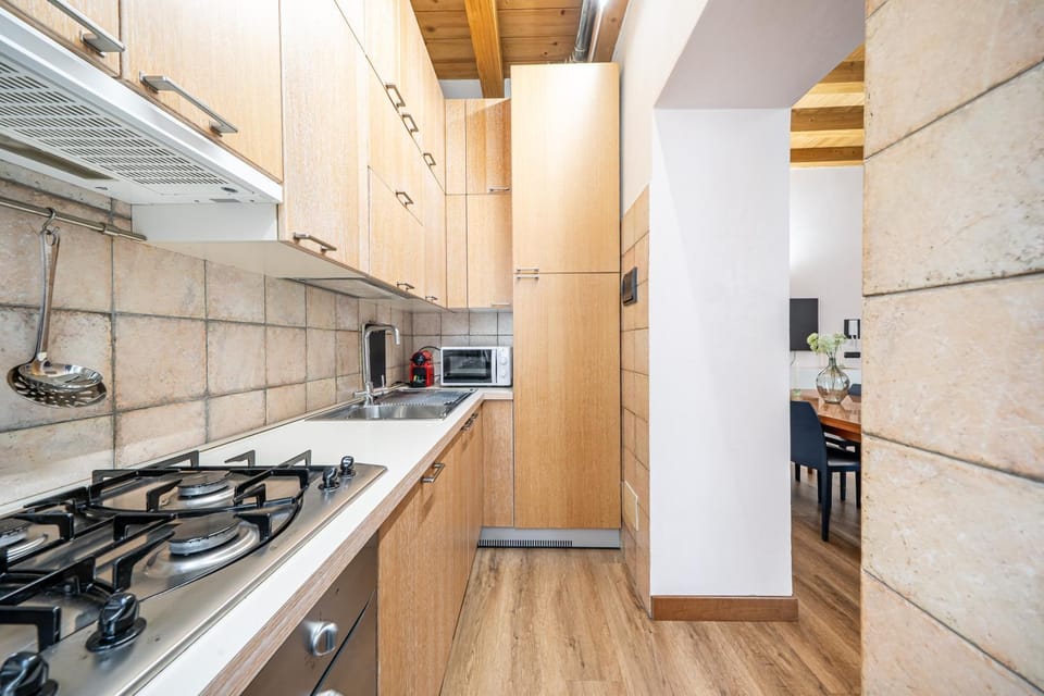 Kitchen or kitchenette, dishwasher, oven, stove