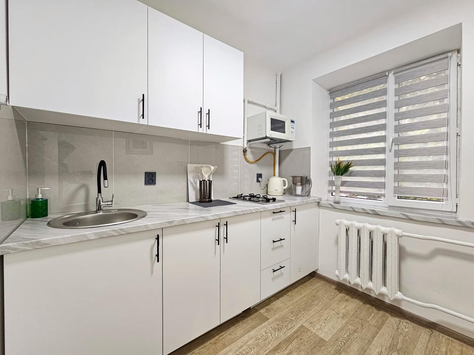 Kitchen or kitchenette, microwave, stove, washing machine