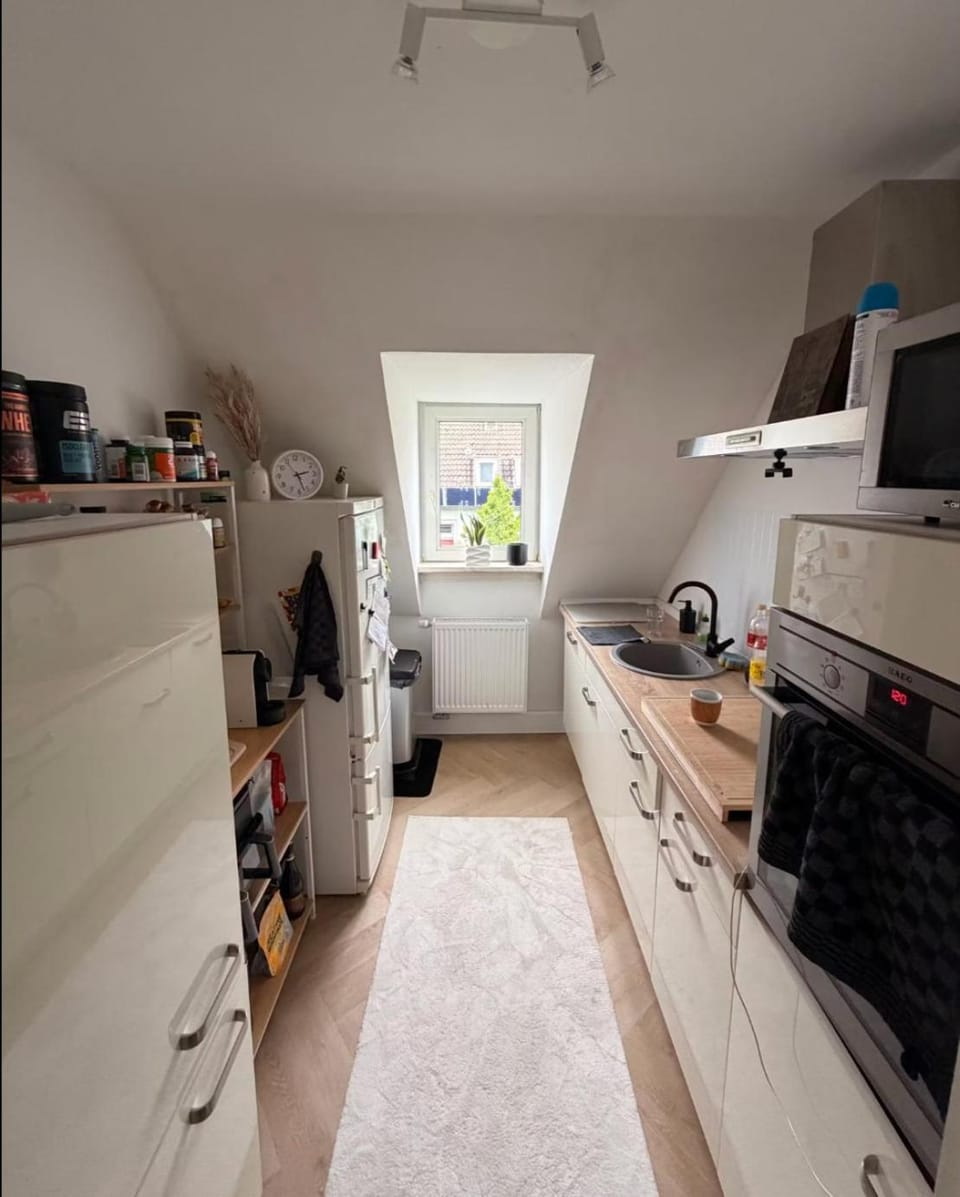 Kitchen or kitchenette, dishwasher, oven, stove