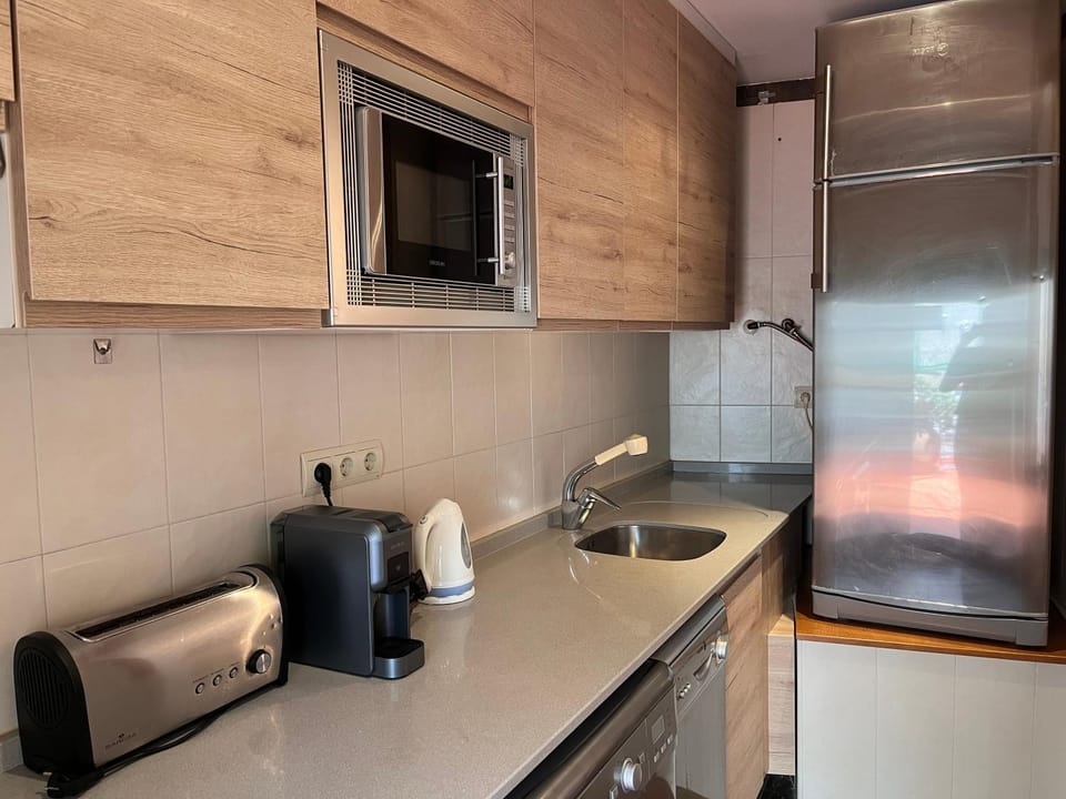 Kitchen or kitchenette, dishwasher, oven, stove, toaster