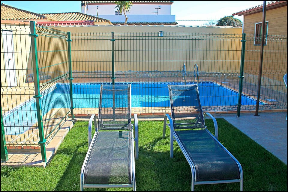 Swimming pool, sunbed