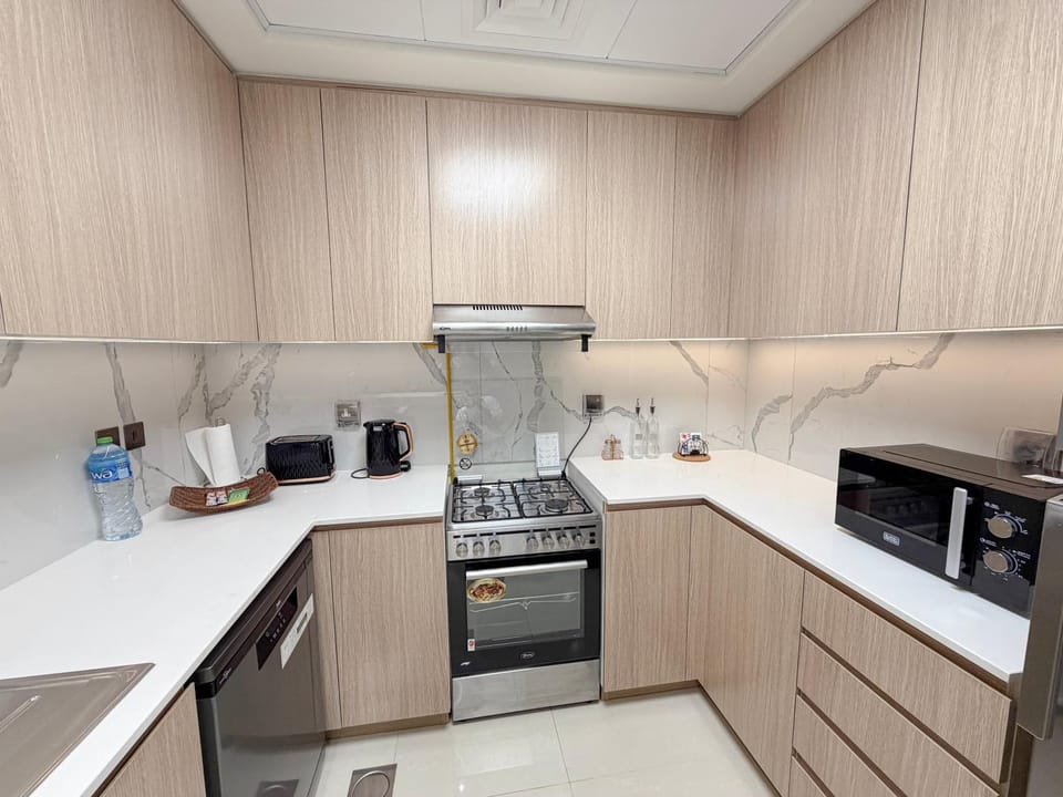 Kitchen or kitchenette, dishwasher, oven, stove, toaster