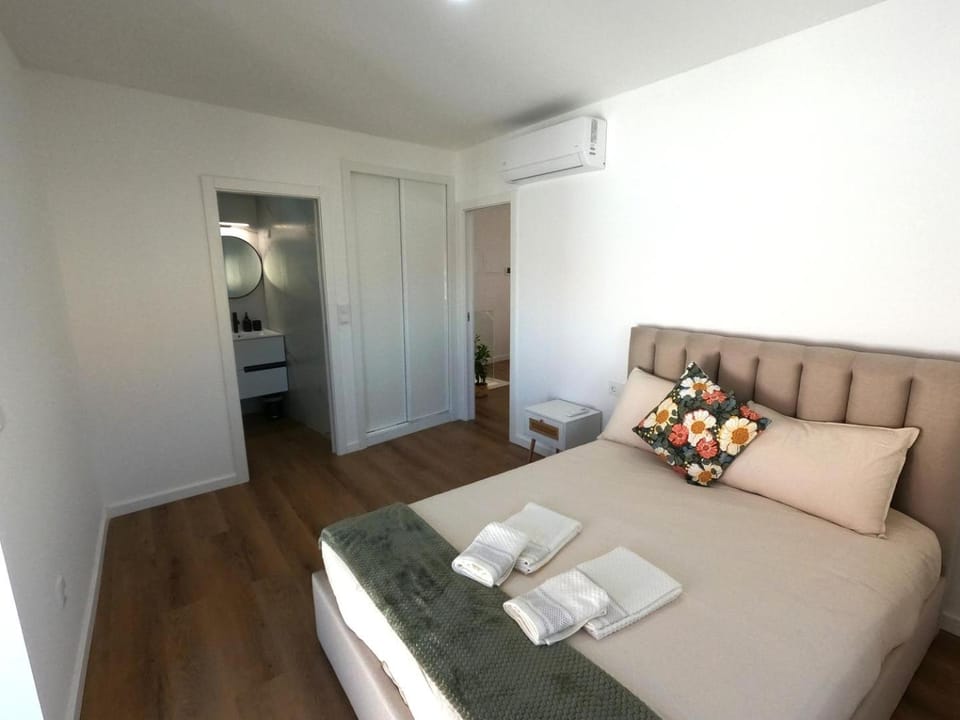 Bed, Bedroom, towels, wardrobe, air conditioner