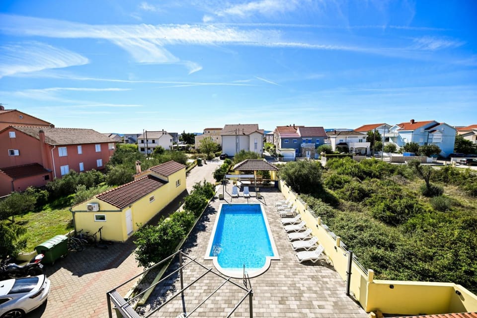 Day, Natural landscape, Pool view, Swimming pool, Parking, sunbed