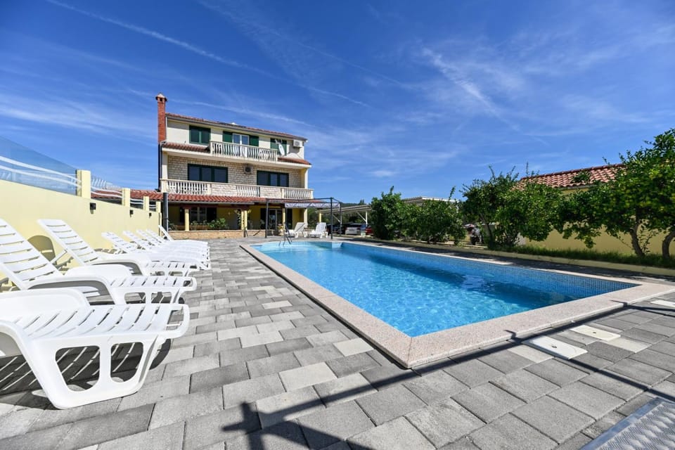 Property building, Patio, Pool view, Swimming pool, sunbed