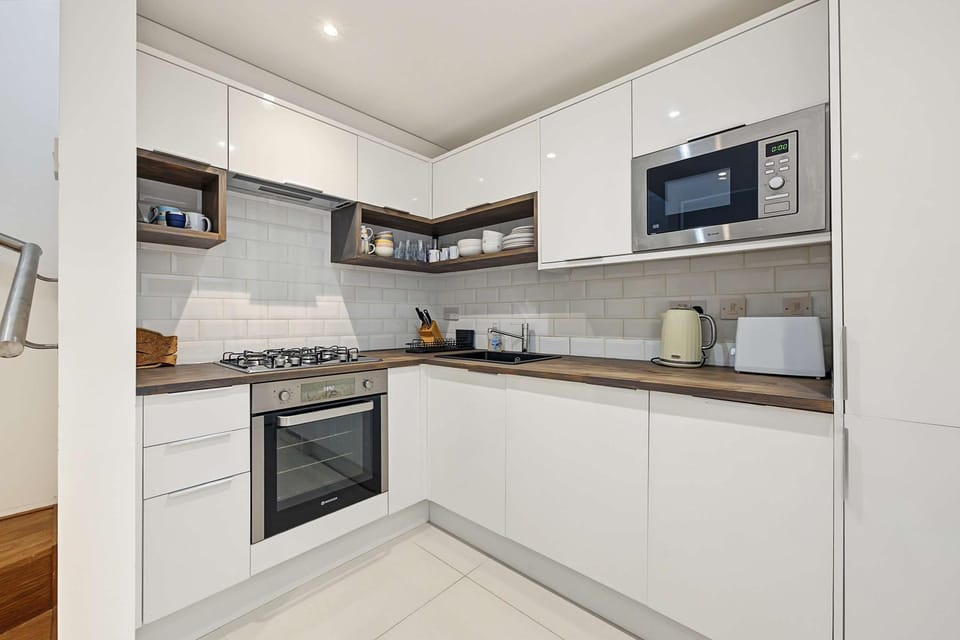 Kitchen or kitchenette, dishwasher, oven, stove