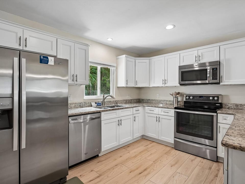 Kitchen or kitchenette, dishwasher, microwave, oven, stove, kitchen