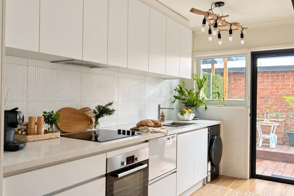 Kitchen or kitchenette, dishwasher, oven, stove