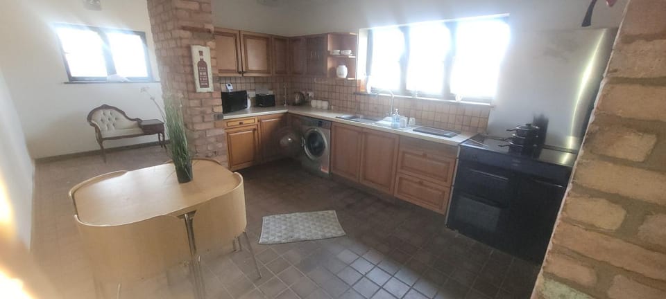 Kitchen or kitchenette, stove, washing machine