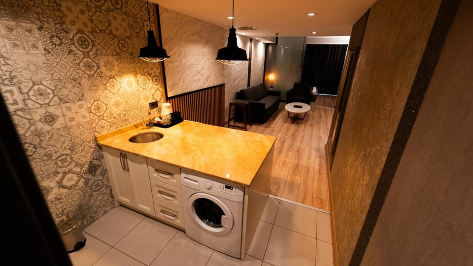 Kitchen or kitchenette, Living room, Seating area, washing machine