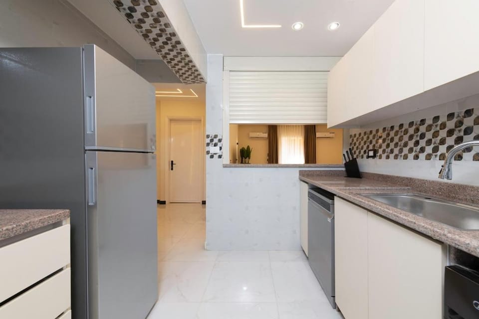 Kitchen or kitchenette, dishwasher, oven, stove