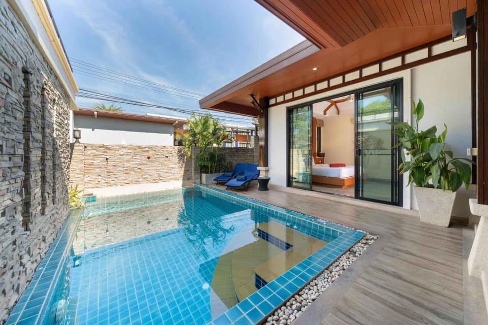 Property building, Bedroom, Pool view, sunbed, towels