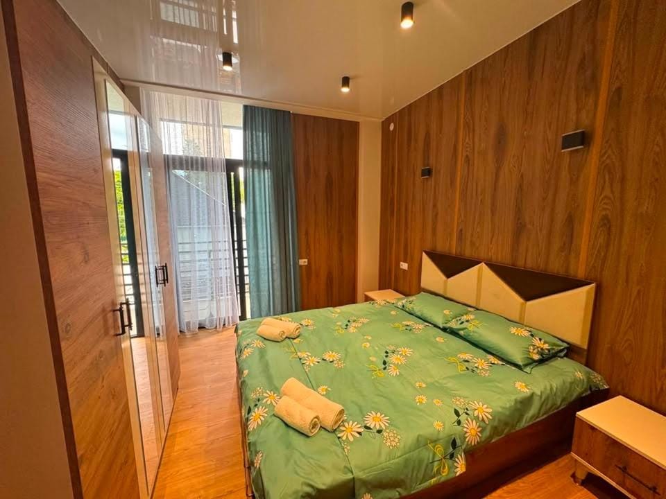 Bed, towels, wardrobe