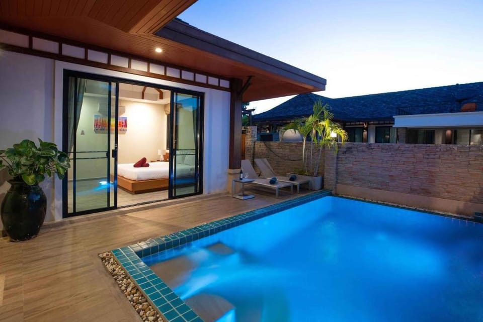 Property building, Patio, Night, Pool view, Swimming pool, Swimming pool, sunbed