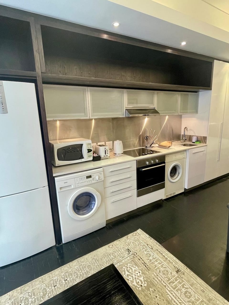 Kitchen or kitchenette, stove, toaster, washing machine, dryer