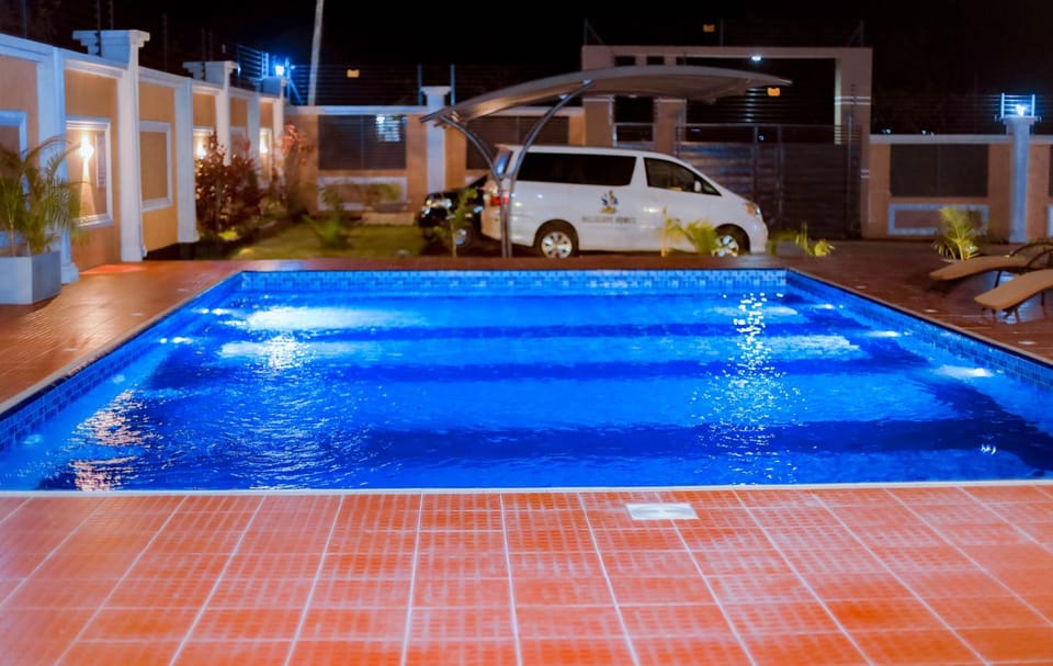 Property building, Night, Pool view, Swimming pool, Location, Parking