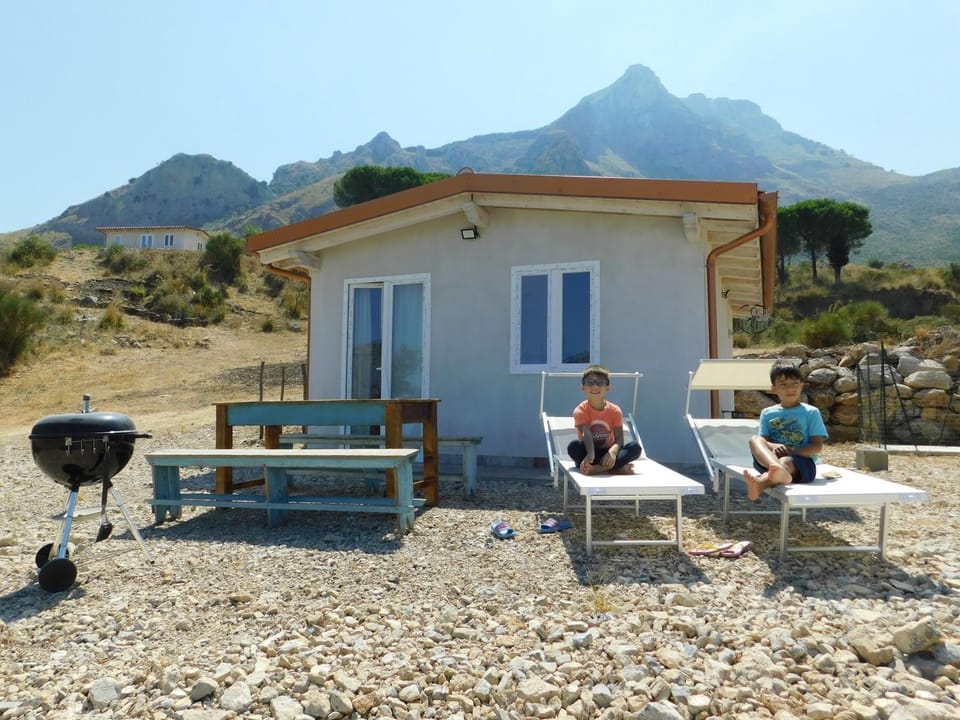 Property building, Patio, People, Natural landscape, BBQ facilities, Dining area, Mountain view, group of guests, sunbed
