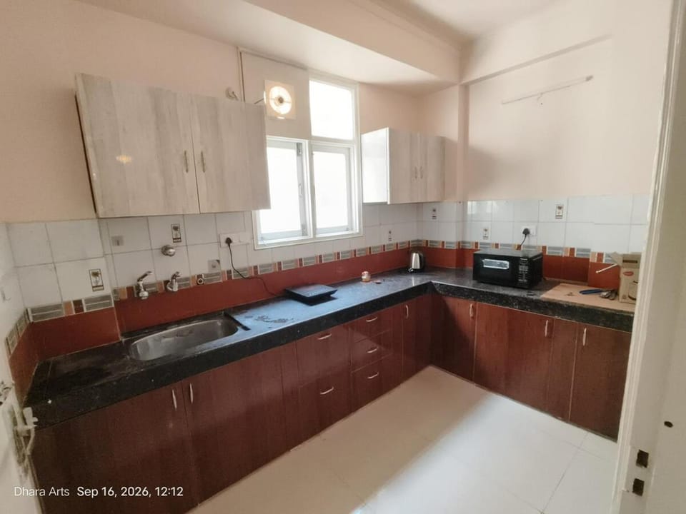Kitchen or kitchenette, microwave, stove