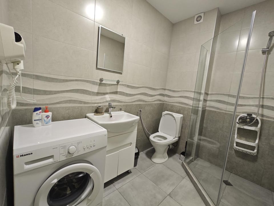Shower, Toilet, Bathroom, towels, washing machine, dryer