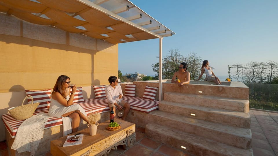 People, View (from property/room), Balcony/Terrace, Living room, Seating area, group of guests