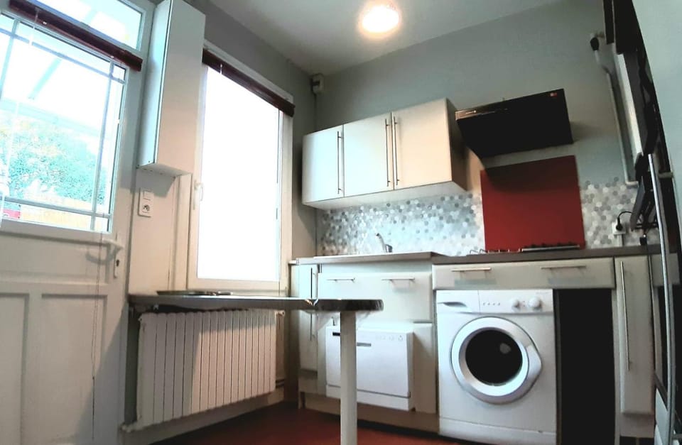 Kitchen or kitchenette, dishwasher, oven, stove, washing machine
