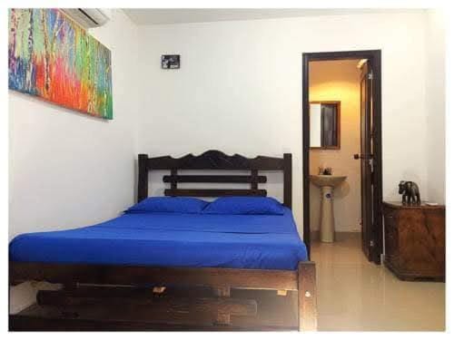 Bed, Bathroom, towels, wardrobe, air conditioner