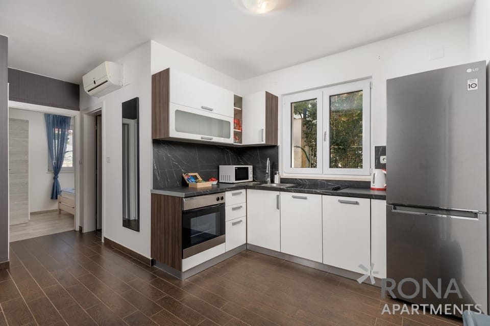 Kitchen or kitchenette, oven, stove, air conditioner