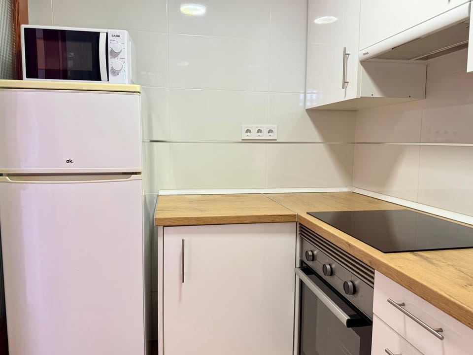 Kitchen or kitchenette, oven, stove