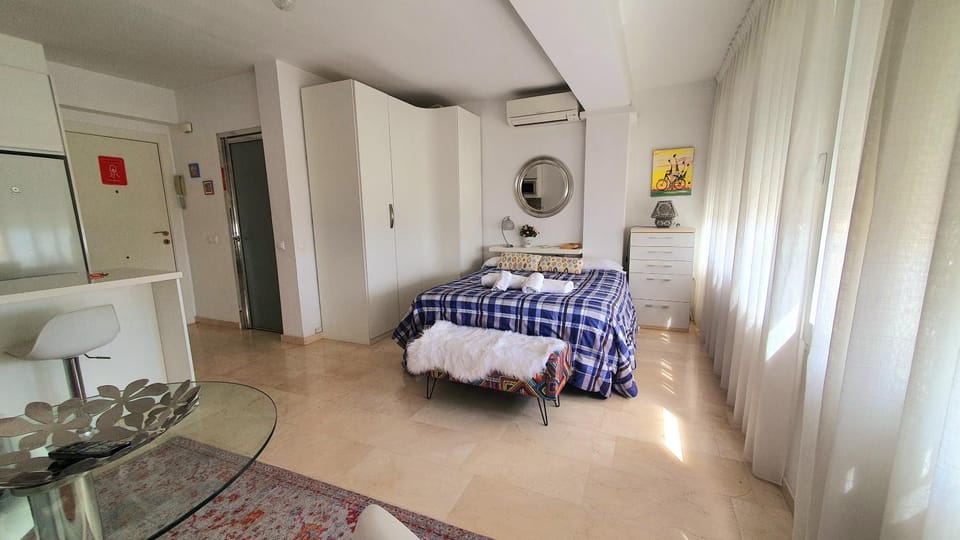 Bed, Living room, Photo of the whole room, Seating area, Bedroom, towels, wardrobe, air conditioner