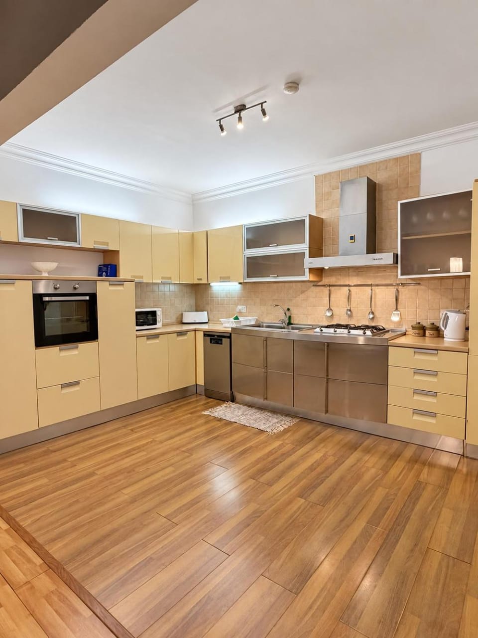 Kitchen or kitchenette, dishwasher, microwave, oven, stove, toaster