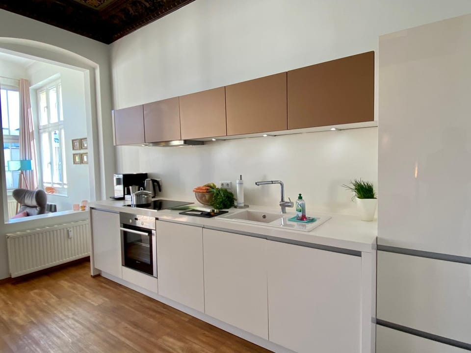 Kitchen or kitchenette, dishwasher, oven, stove, toaster
