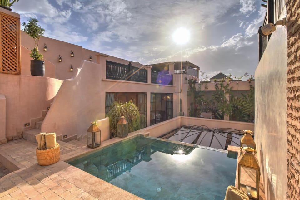 Property building, Patio, Day, Natural landscape, Pool view, Swimming pool, Swimming pool, sunbed