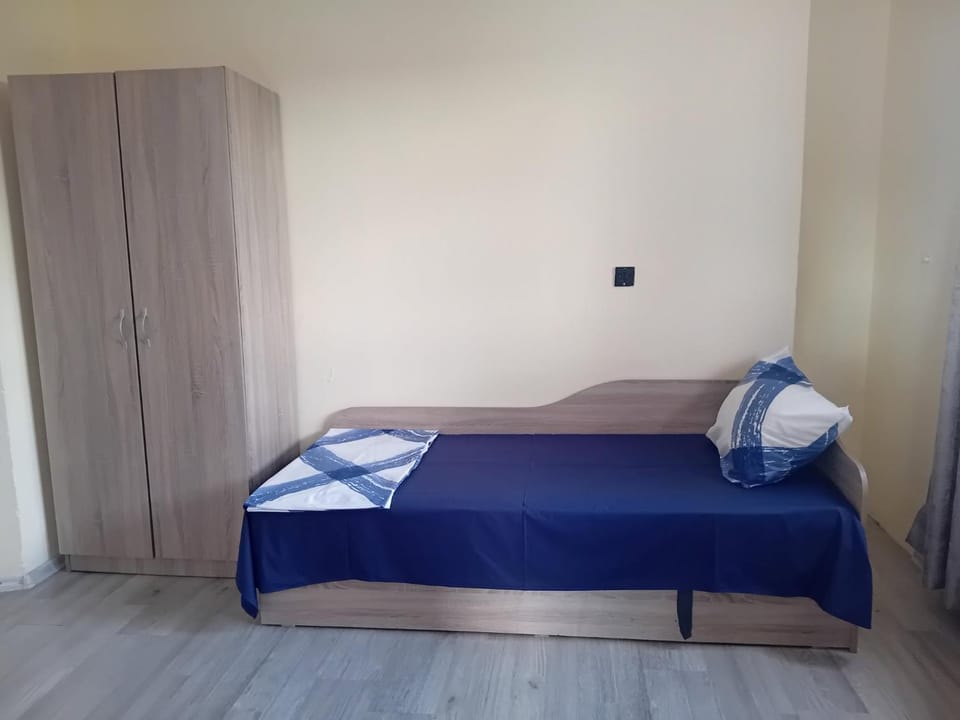 Bed, towels, wardrobe