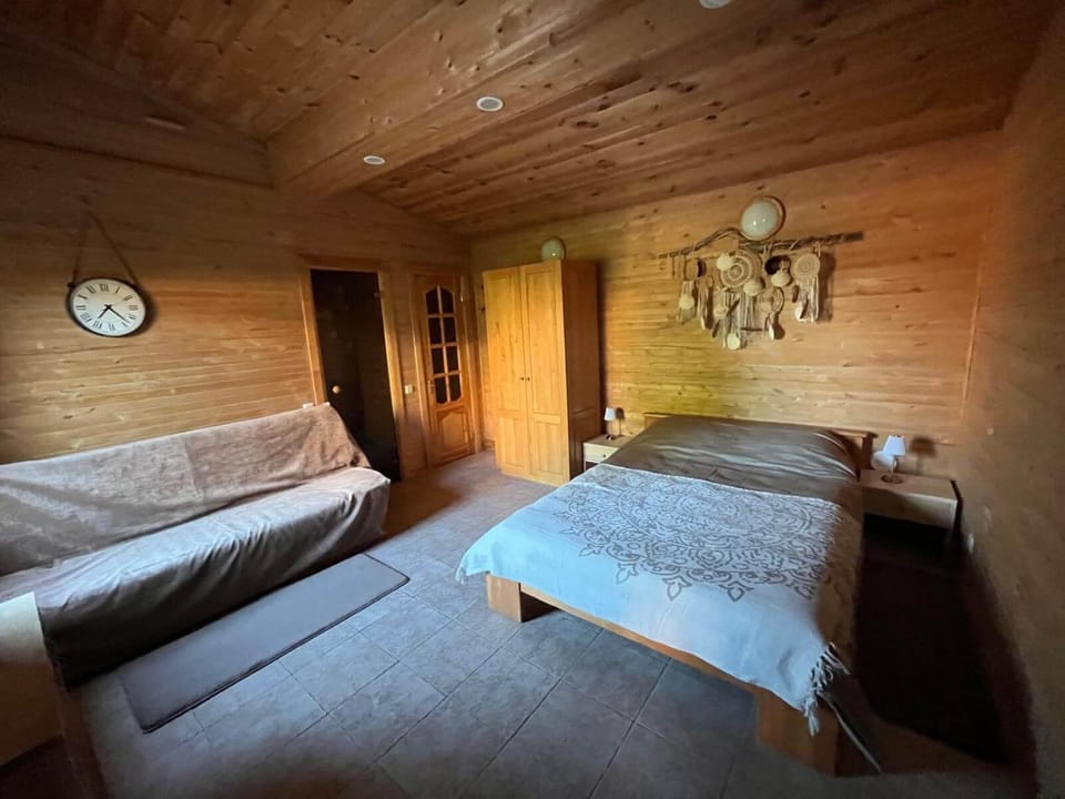 Bed, Living room, Seating area, Bedroom