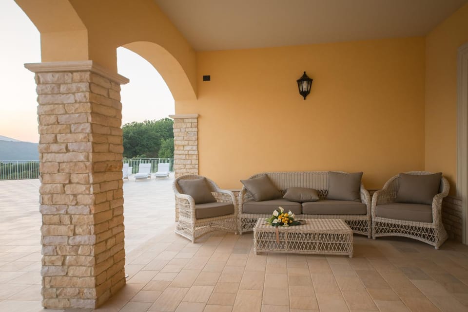 Property building, Patio, Natural landscape, View (from property/room), Balcony/Terrace, Living room, Seating area, Swimming pool, Breakfast