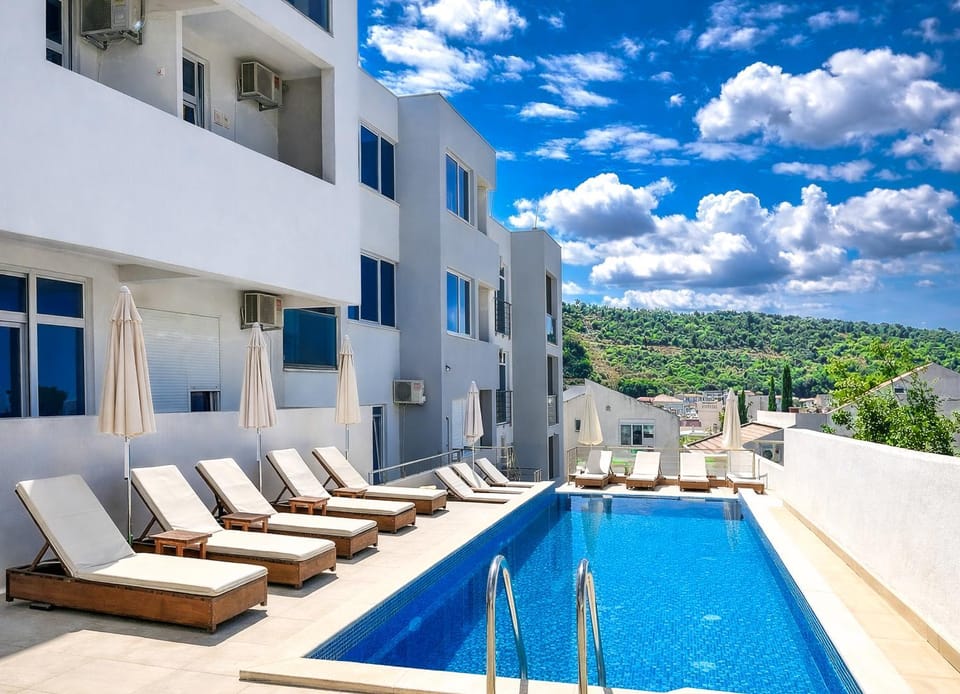 Property building, Day, Natural landscape, View (from property/room), Seating area, Pool view, Swimming pool, sunbed