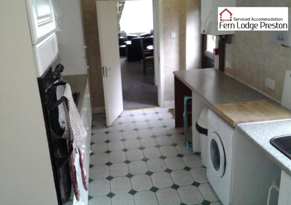Kitchen or kitchenette, oven, stove, washing machine, dryer