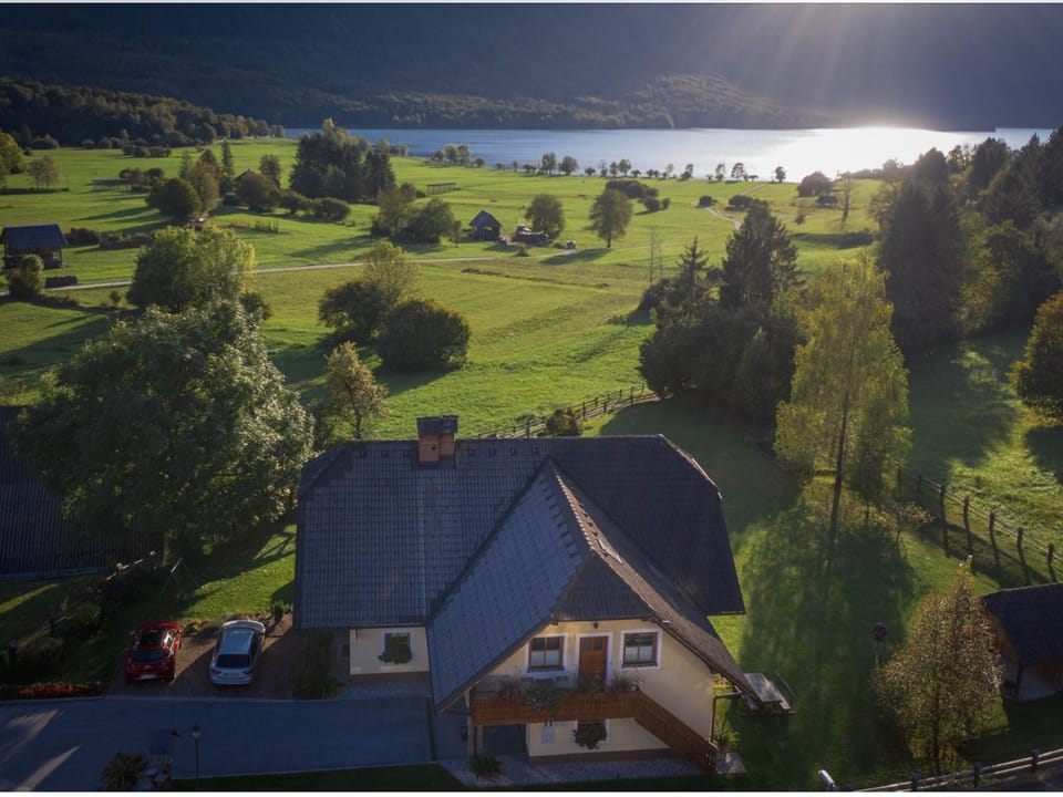Property building, Nearby landmark, Day, Natural landscape, Bird's eye view, Lake view, Mountain view