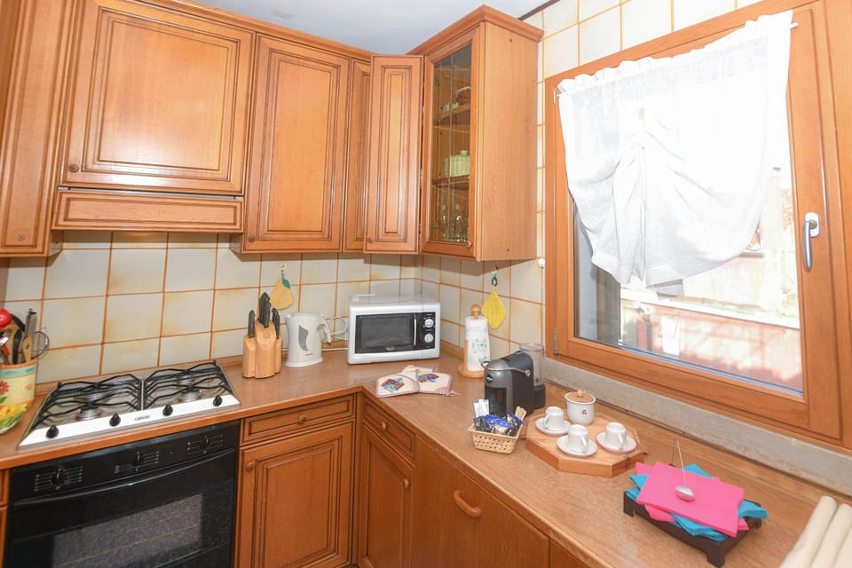Kitchen or kitchenette, dishwasher, microwave, oven, stove, toaster