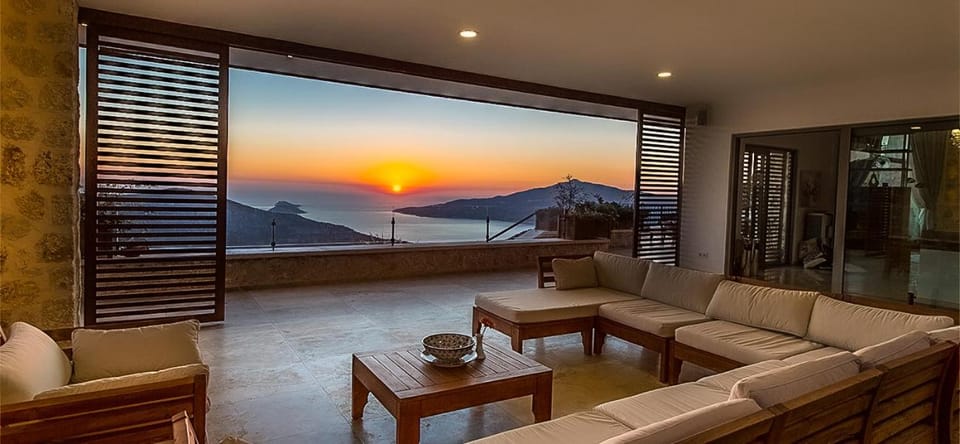 Property building, Patio, Natural landscape, Balcony/Terrace, Seating area, Sea view, Sunset