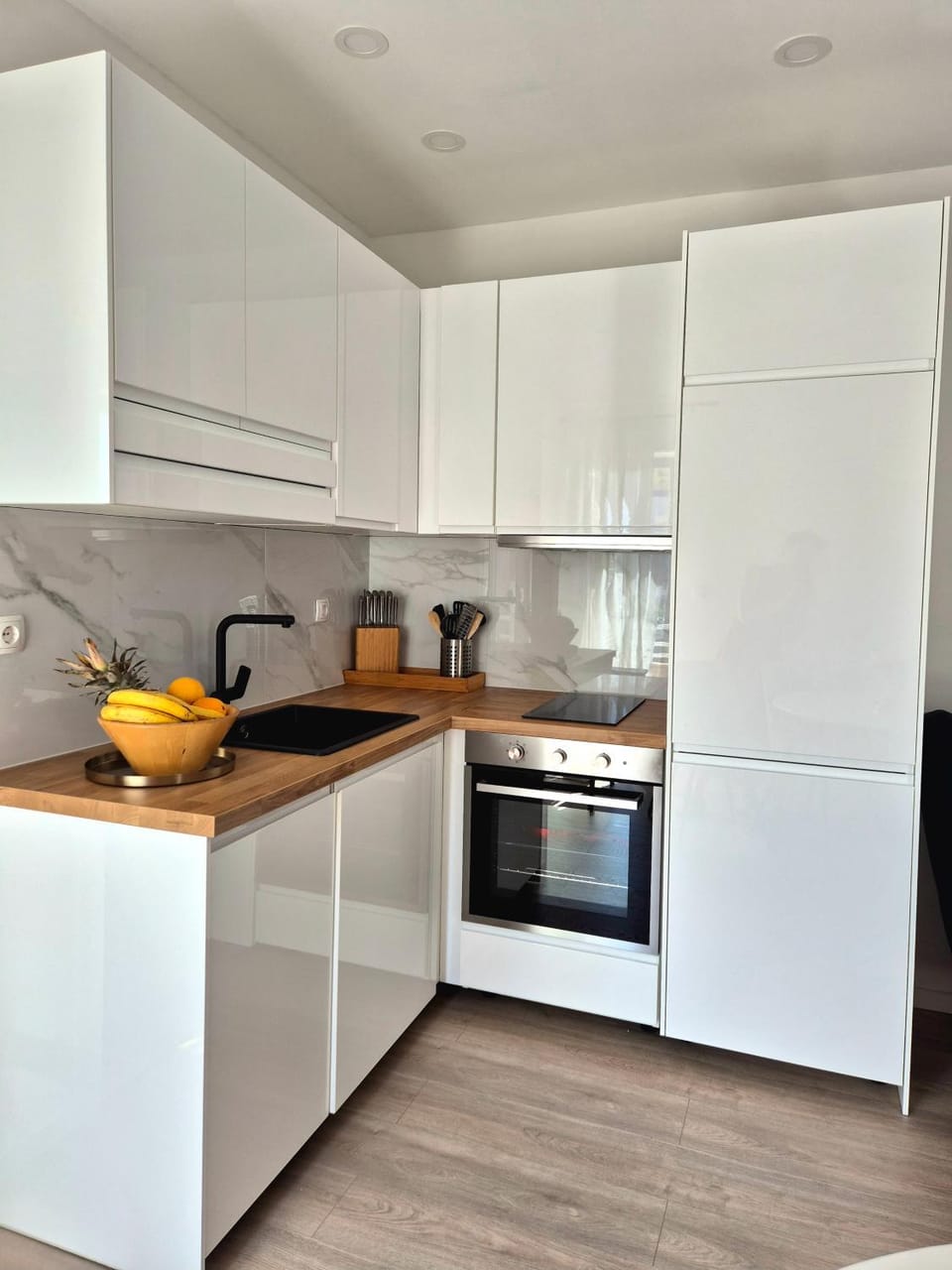 Kitchen or kitchenette, dishwasher, oven, stove
