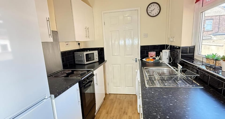 Kitchen or kitchenette, microwave, oven, stove, kitchen, kitchen