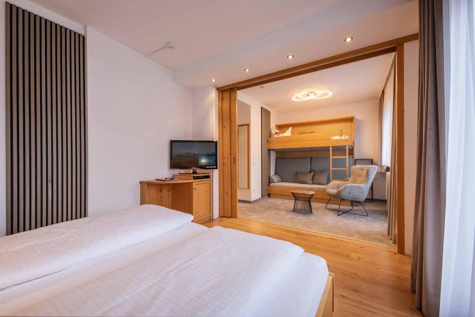 Bed, TV and multimedia, Seating area, Bedroom, hair dresser