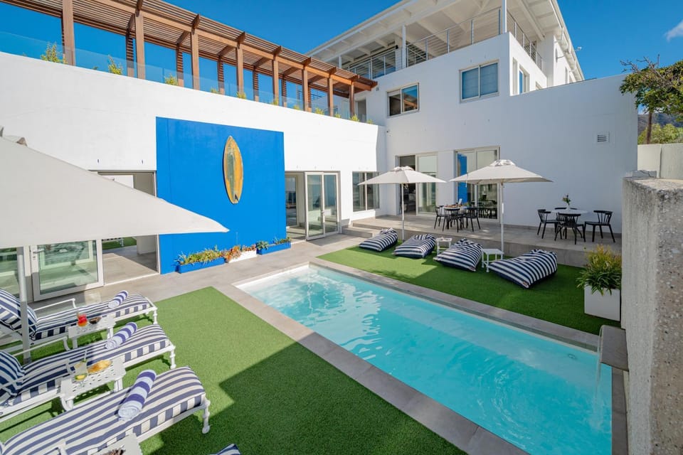 Property building, Day, Seating area, Pool view, Swimming pool, sunbed