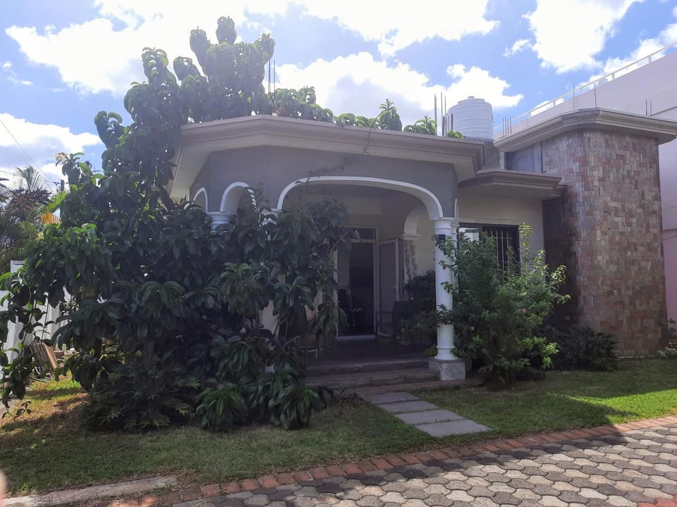 Cardamon Villa is a 2 bedroom with 1 bathroom and seperate toilet detached house with AC and swimming pool , 5 minutes walk from Flic en Flac public beach Villa in Flic en Flac