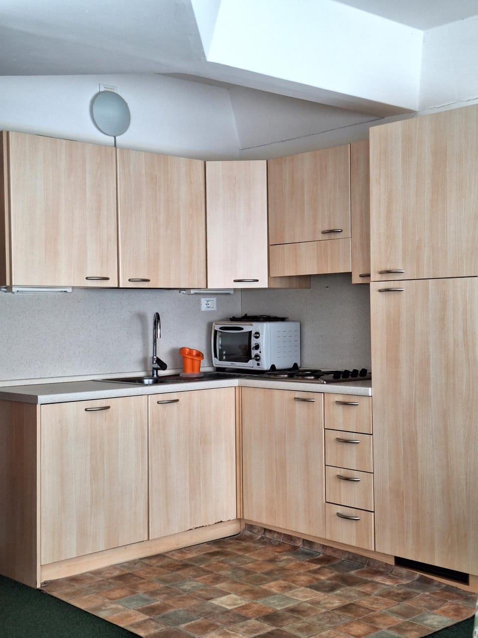 Kitchen or kitchenette, dishwasher, oven, stove