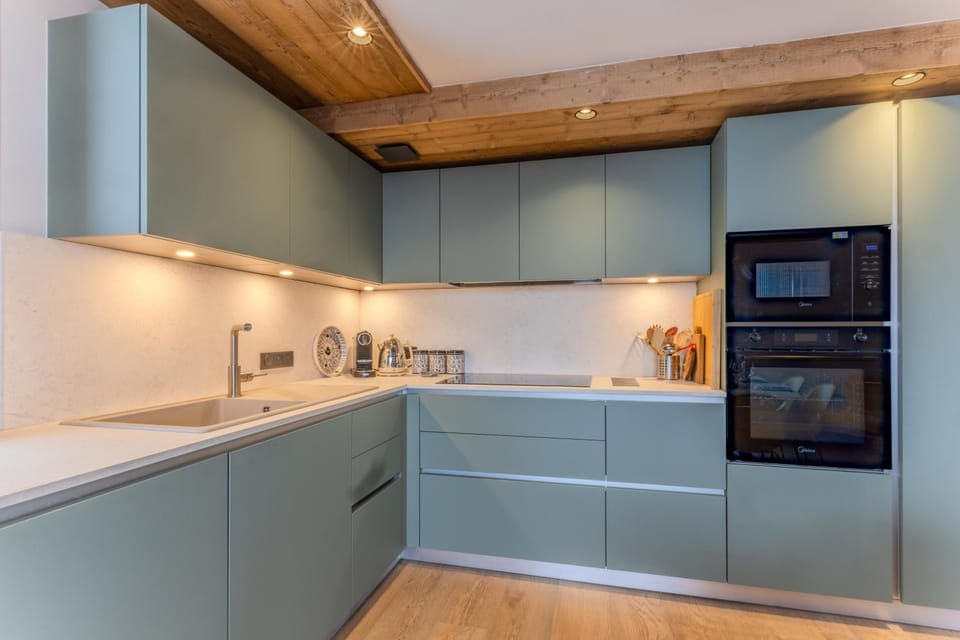 Kitchen or kitchenette, dishwasher, oven, stove