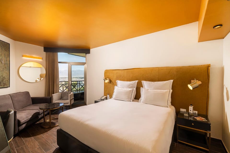 Bed, Living room, Seating area, Bedroom