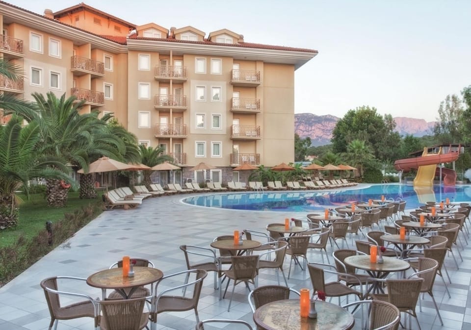 Property building, Patio, Restaurant/places to eat, Day, Pool view, Swimming pool