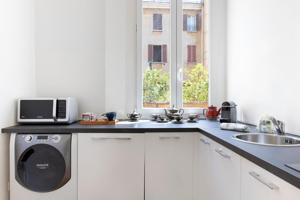 Kitchen or kitchenette, dishwasher, stove, washing machine
